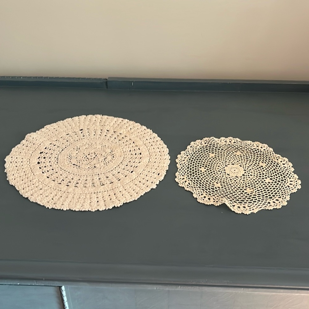 Two beige doillies